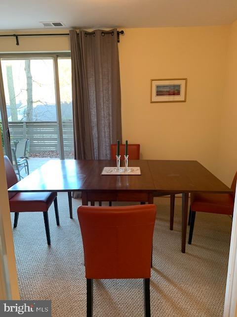 116 Cross Keys Road, Unit A A Baltimore, MD 21210 - Photo 5 of 15 a view of a dining room with furniture and window