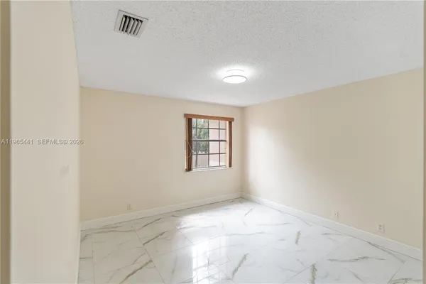 a view of a hallway with an entryway