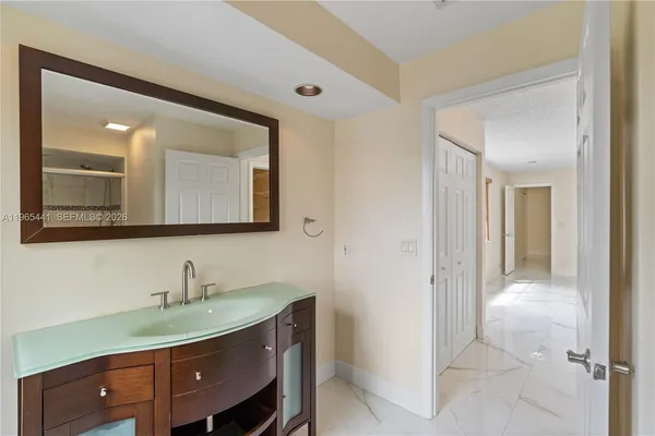 a view of a hallway with washer and dryer