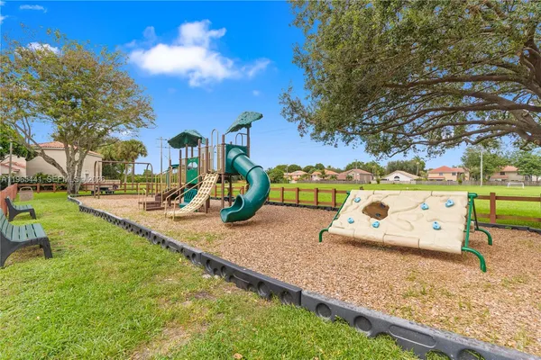 a view of a park with large trees