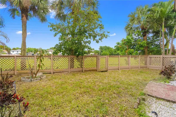 a view of a hallway with closet and a bathroom