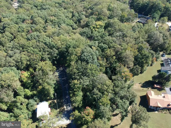 a view of a house with a yard and garden