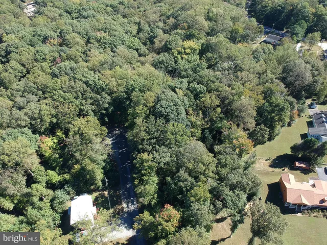 a view of a house with a yard and garden
