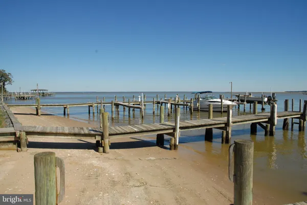 a view of a swimming pool with a lounge chair