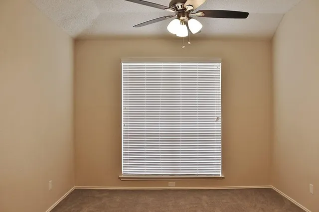 en view of an empty room with a window