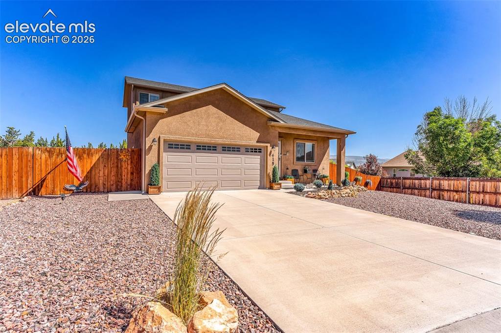 415 Empire Road Canon City, CO 81212 - Photo 6 of 40 a front view of a house with a yard