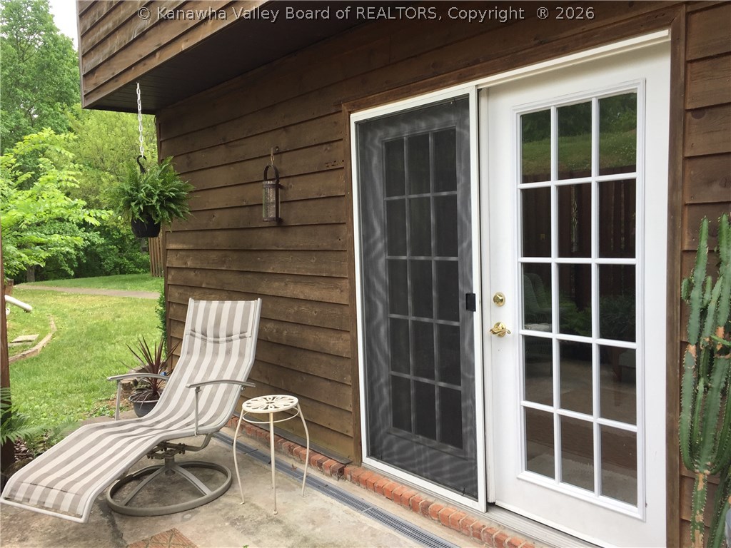 203 Powderhorn Road Charleston, WV 25314 - Photo 26 of 28 patio doors lead into the living room.