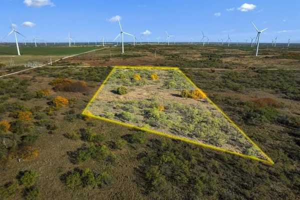 a view of a yard with an ocean view