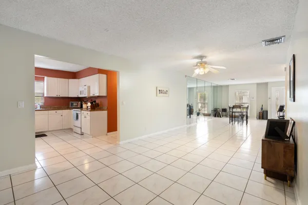 a kitchen with cabinets appliances and a window