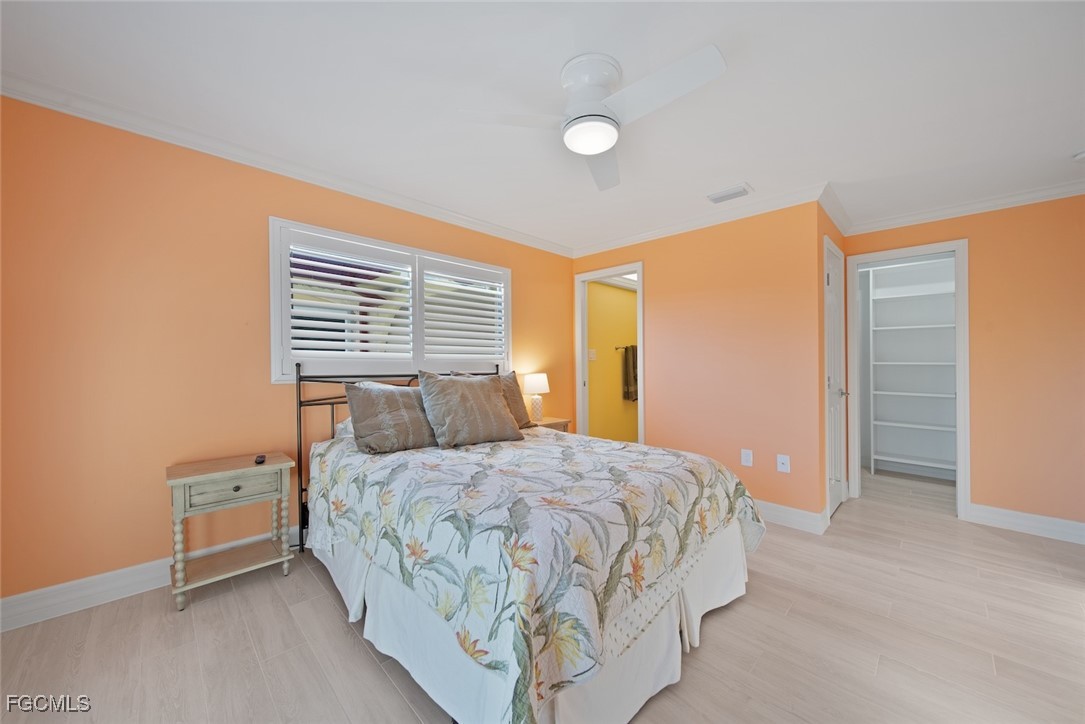 1610 Middle Gulf Drive, Unit D5 Sanibel, FL 33957 - Photo 29 of 47 a bedroom with a bed and a window