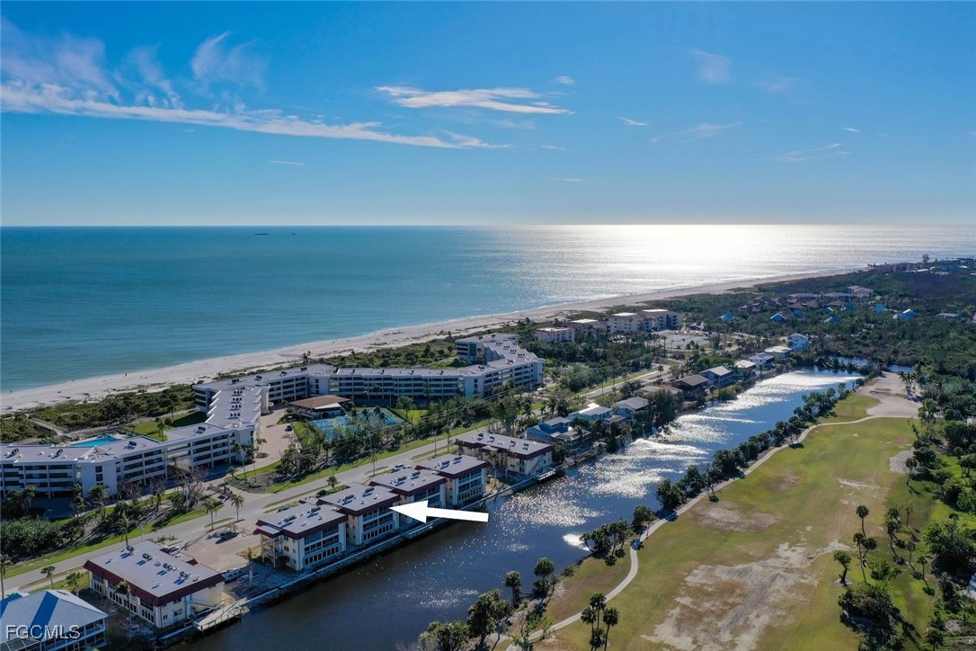 1610 Middle Gulf Drive, Unit D5 Sanibel, FL 33957 - Photo 3 of 47 an aerial view of a city with ocean view