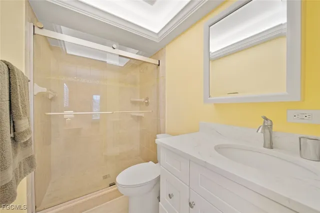 a bedroom with two beds and a night stand