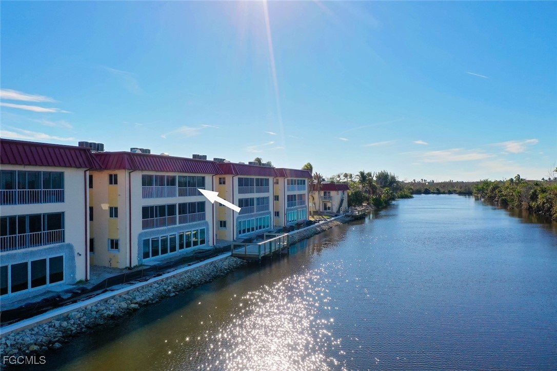 1610 Middle Gulf Drive, Unit D5 Sanibel, FL 33957 - Photo 38 of 47 a view of residential houses with outdoor space and lake view