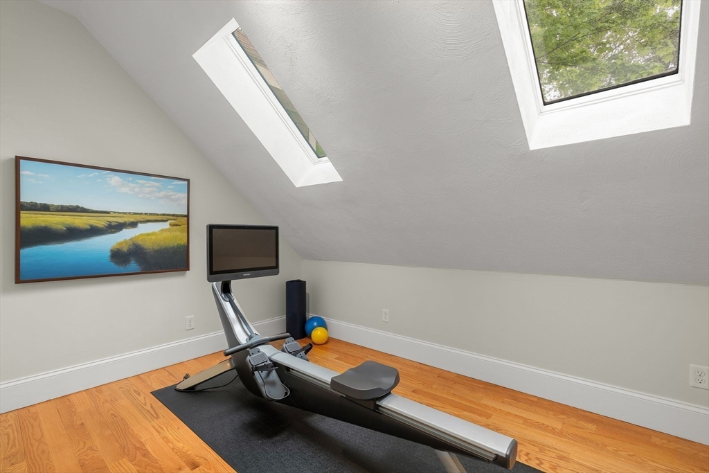 165 Park Avenue, Unit 165 Arlington, MA 02476 - Photo 18 of 32 a room with furniture and a flat screen tv