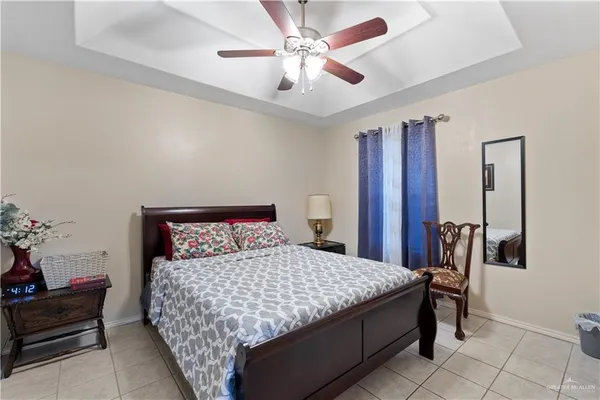 a view of kitchen with sink refrigerator and dining table