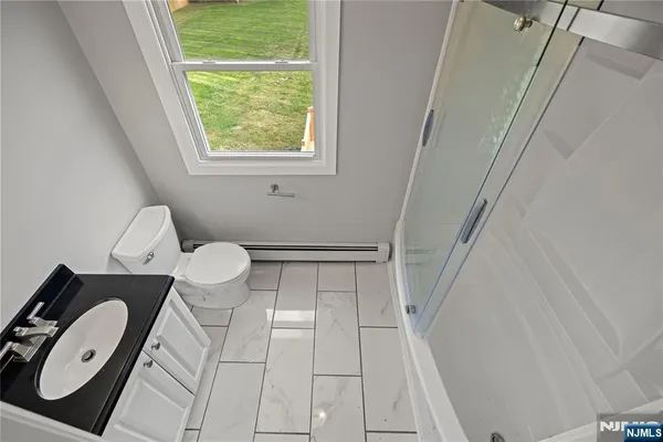 a bathroom with a toilet and a vanity