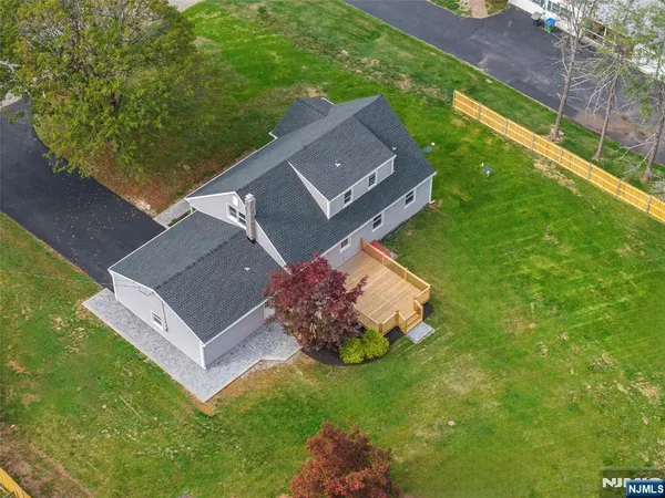 an aerial view of residential house with an outdoor space