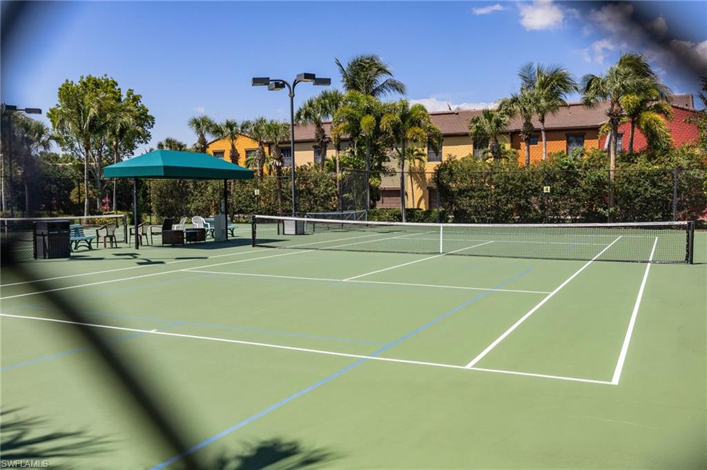 9128 Delano Street, Unit 892 Naples, FL 34113 - Photo 46 of 49 a view of a tennis court
