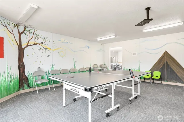 a room with table and chairs