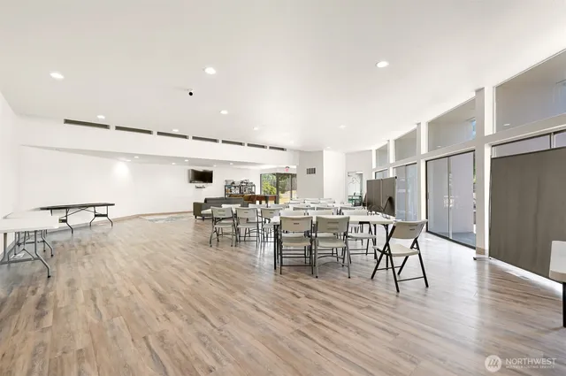 a view of a dining room with furniture and wooden floor