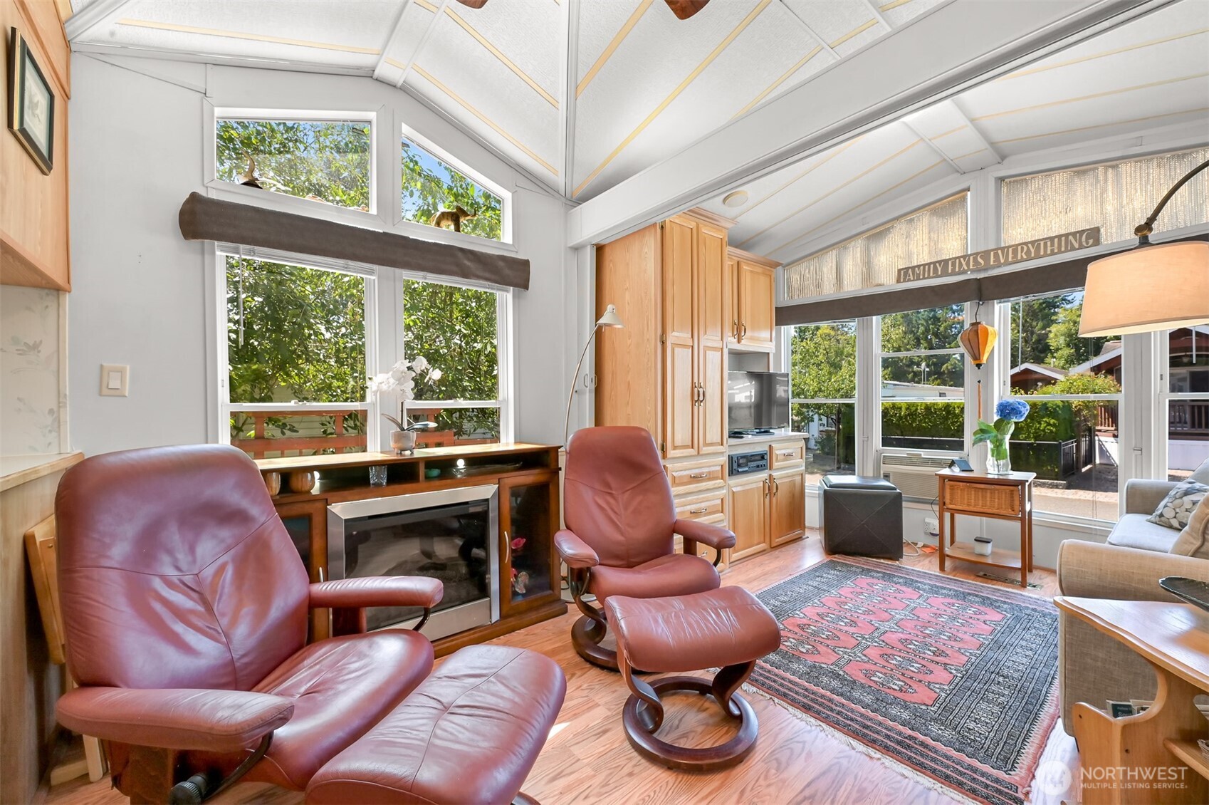 5001 Bay Road, Unit D134 Blaine, WA 98230 - Photo 3 of 32 a living room with furniture fireplace and large windows