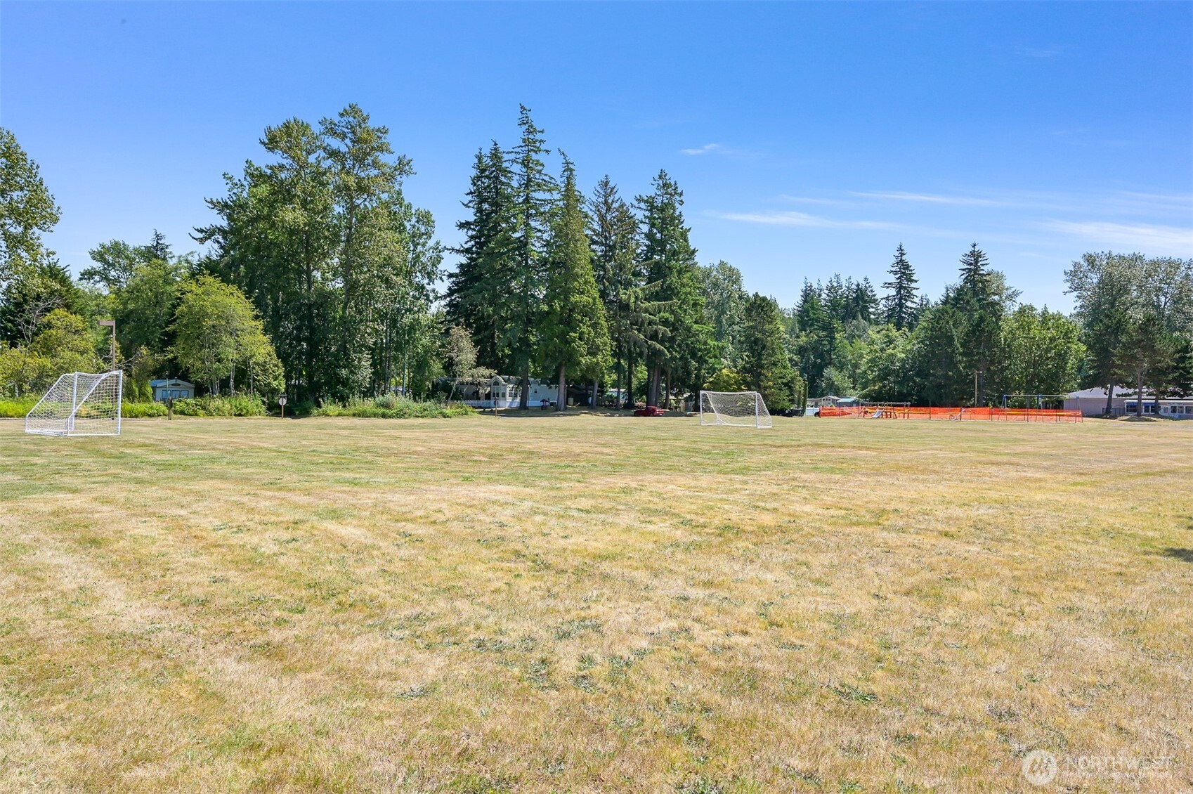 5001 Bay Road, Unit D134 Blaine, WA 98230 - Photo 31 of 32 a view of outdoor space with yard and trees in the background