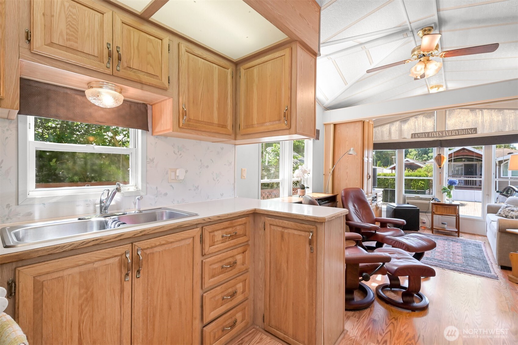 5001 Bay Road, Unit D134 Blaine, WA 98230 - Photo 8 of 32 a kitchen with sink refrigerator and window