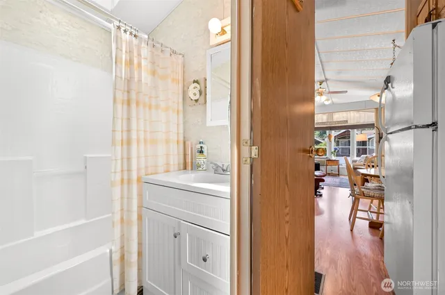 a bathroom with a shower and a sink