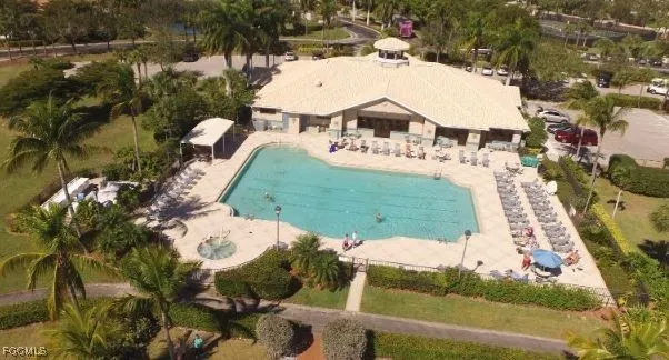 a view of a swimming pool with a yard