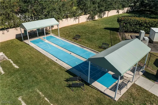 a view of a backyard with chairs