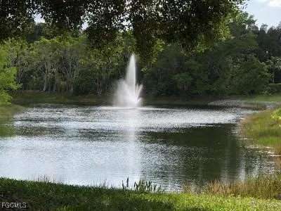 a view of lake with green space