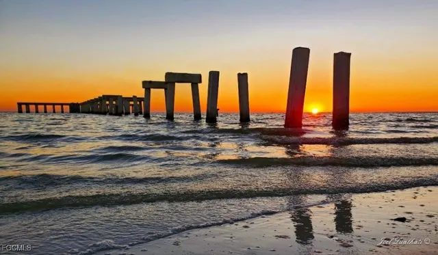 a view of swimming pool and outdoor seating