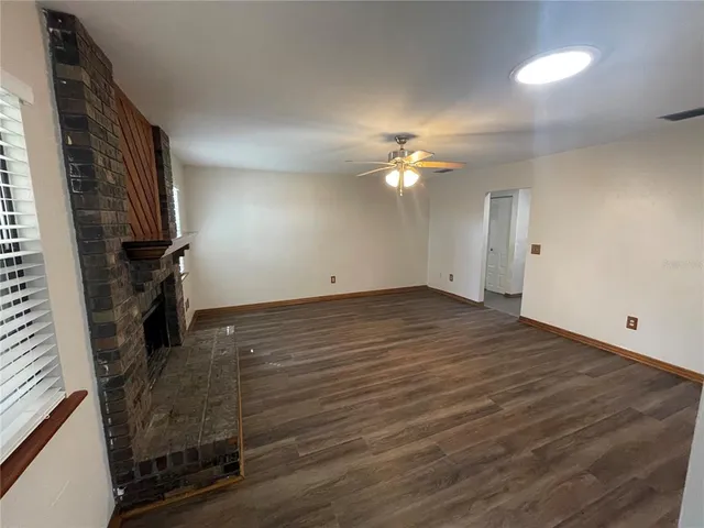 a kitchen with a stove sink and cabinets