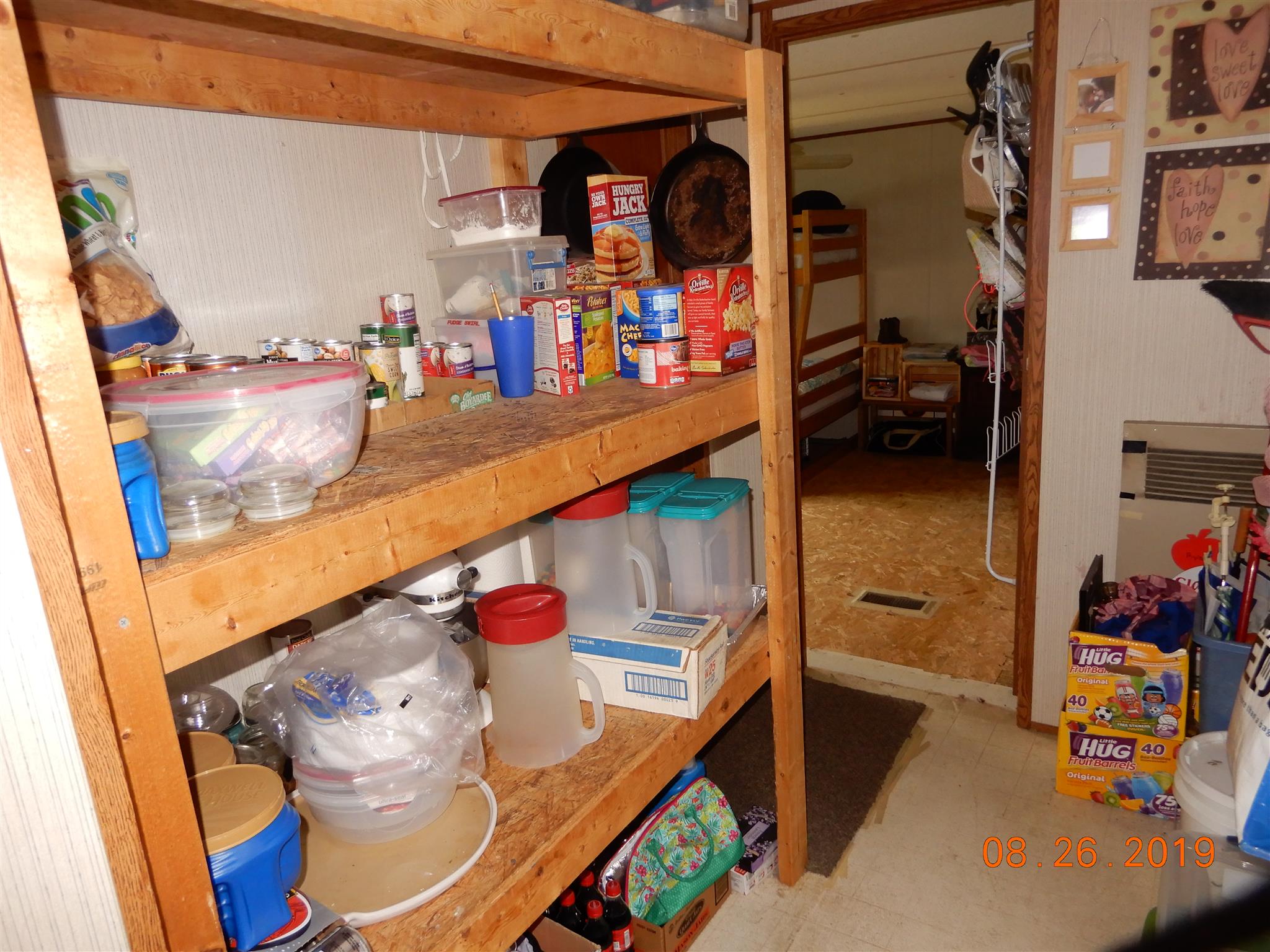 211 Talmo Road Cumberland Furnace, TN 37051 - Photo 11 of 26 Pantry shelves area with laundry hook-ups behind