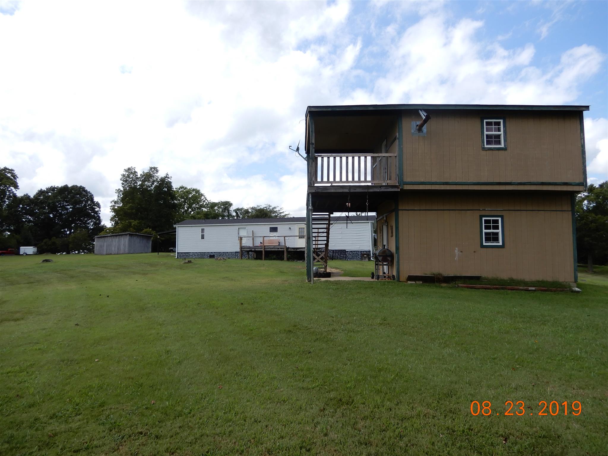 211 Talmo Road Cumberland Furnace, TN 37051 - Photo 15 of 26 Storage building and rear of trailer