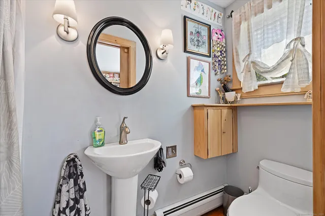 a bathroom with a toilet and a sink