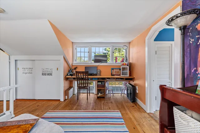 a view of a living room and dining room
