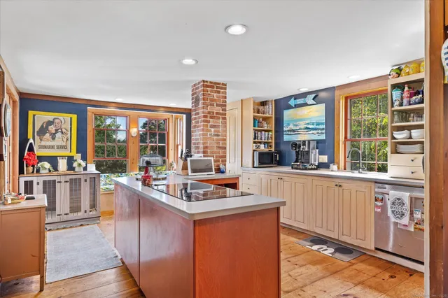 a kitchen with stainless steel appliances granite countertop a stove and a refrigerator