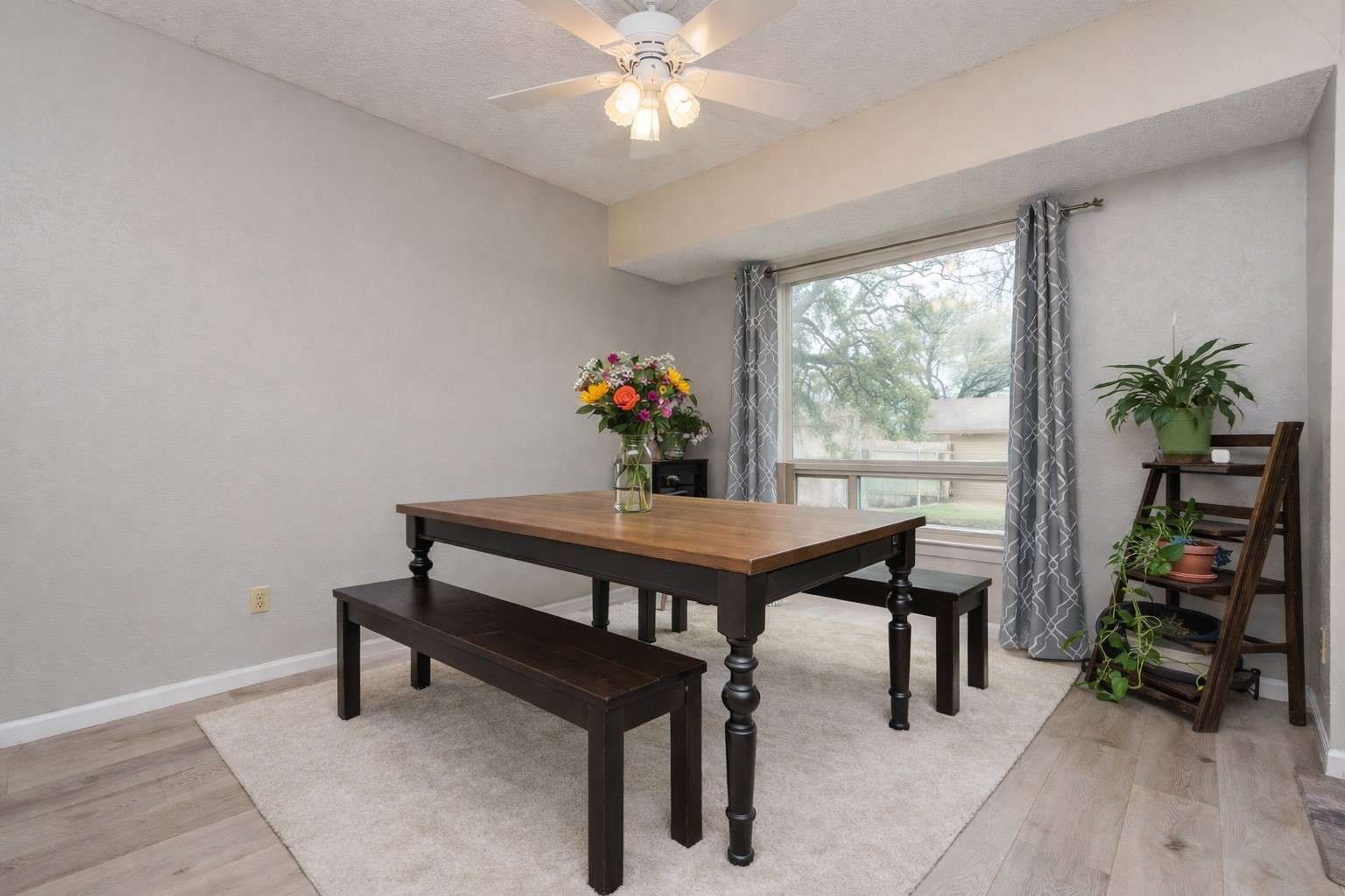 11719 Running Fox Trail Austin, TX 78759 - Photo 10 of 23 a view of a dining room with furniture wooden floor and a chandelier