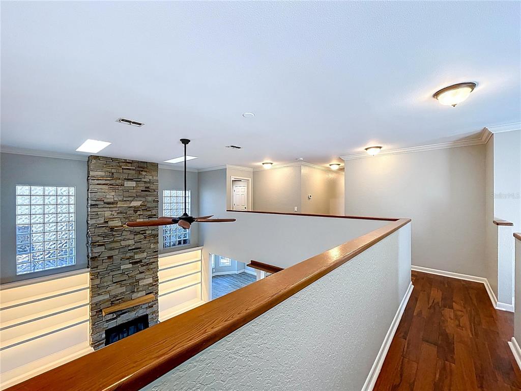 10655 Lakeview Drive New Port Richey, FL 34654 - Photo 34 of 83 a view of a kitchen with kitchen island a stove a wooden floor and a large window