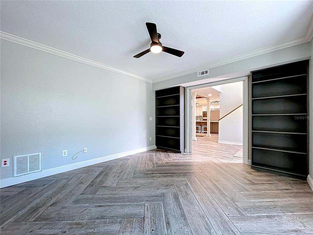 10655 Lakeview Drive New Port Richey, FL 34654 - Photo 5 of 83 wooden floor in an empty room with a window