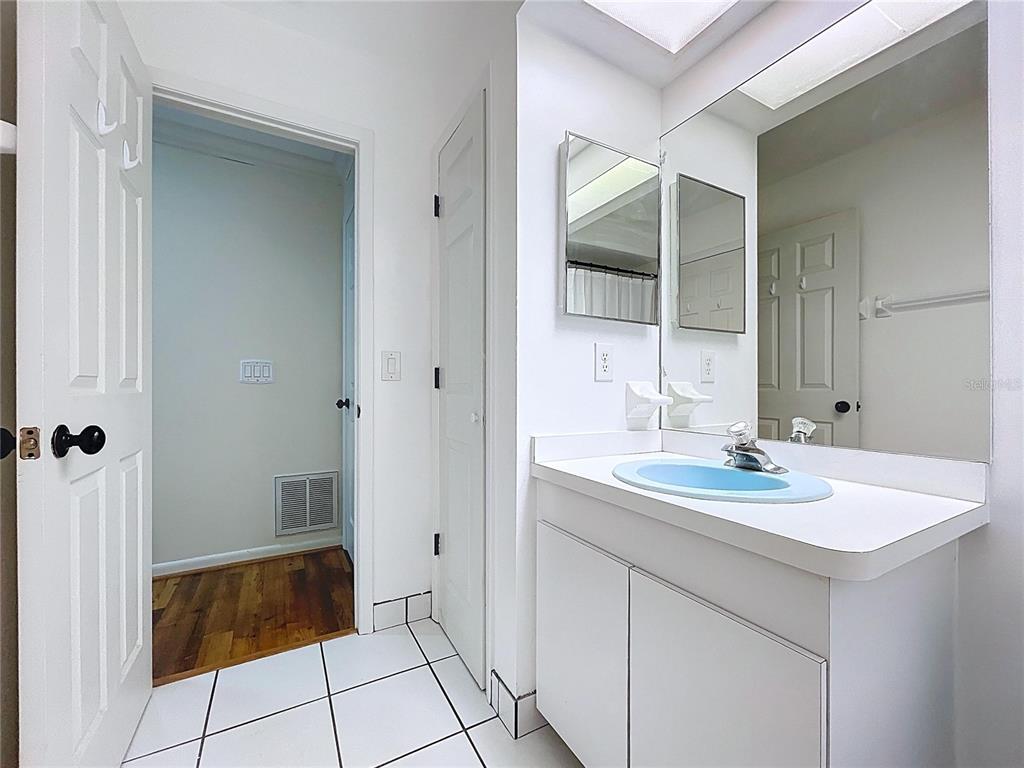 10655 Lakeview Drive New Port Richey, FL 34654 - Photo 52 of 83 a bathroom with a sink and a mirror