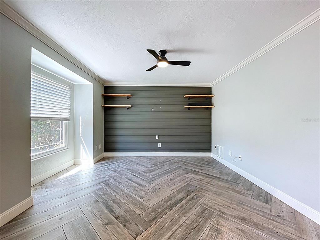 10655 Lakeview Drive New Port Richey, FL 34654 - Photo 6 of 83 a view of an empty room with a window