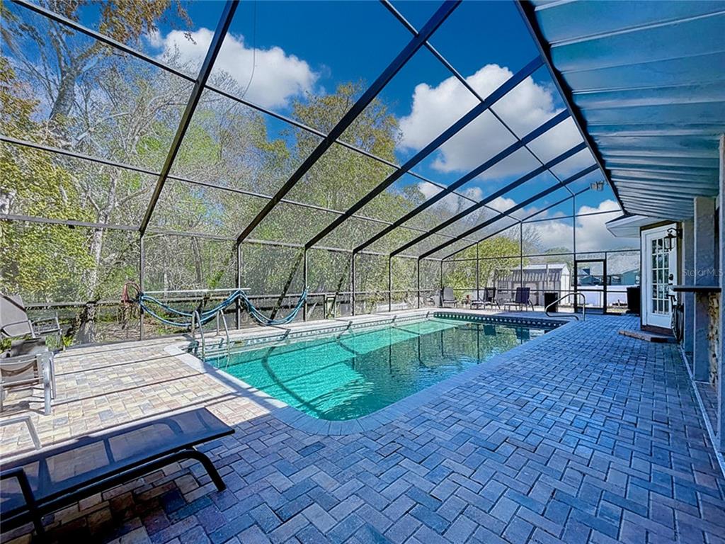 10655 Lakeview Drive New Port Richey, FL 34654 - Photo 64 of 83 a view of a backyard with sitting area