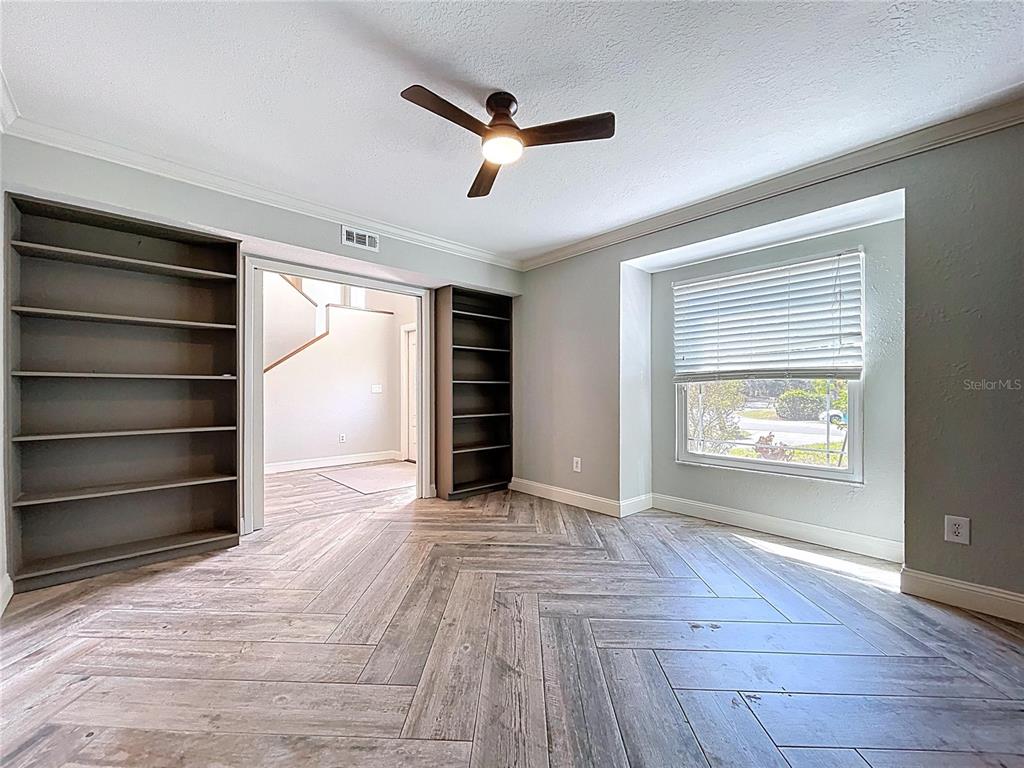 10655 Lakeview Drive New Port Richey, FL 34654 - Photo 7 of 83 a view of an empty room with a window and a kitchen