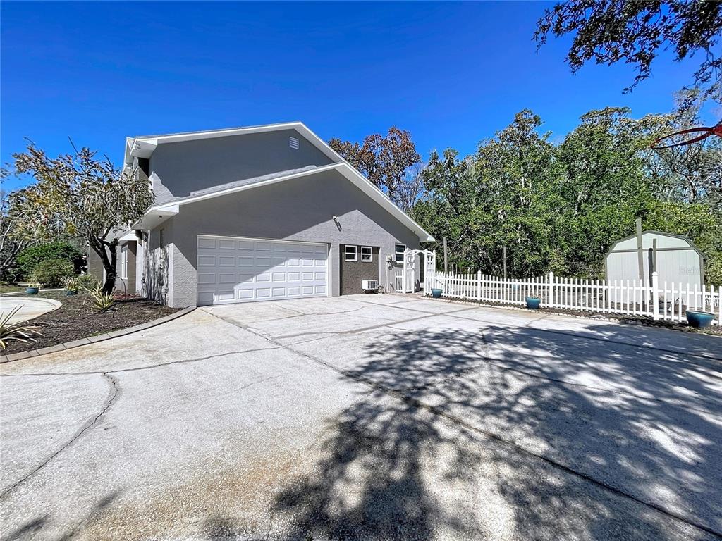 10655 Lakeview Drive New Port Richey, FL 34654 - Photo 73 of 83 a house with trees in the background