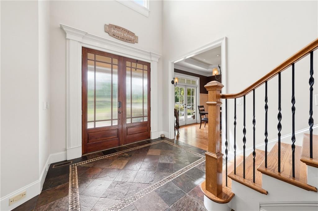 3535 Dr Bramblett Road Cumming, GA 30028 - Photo 11 of 91 a view of a hallway with wooden floor and staircase