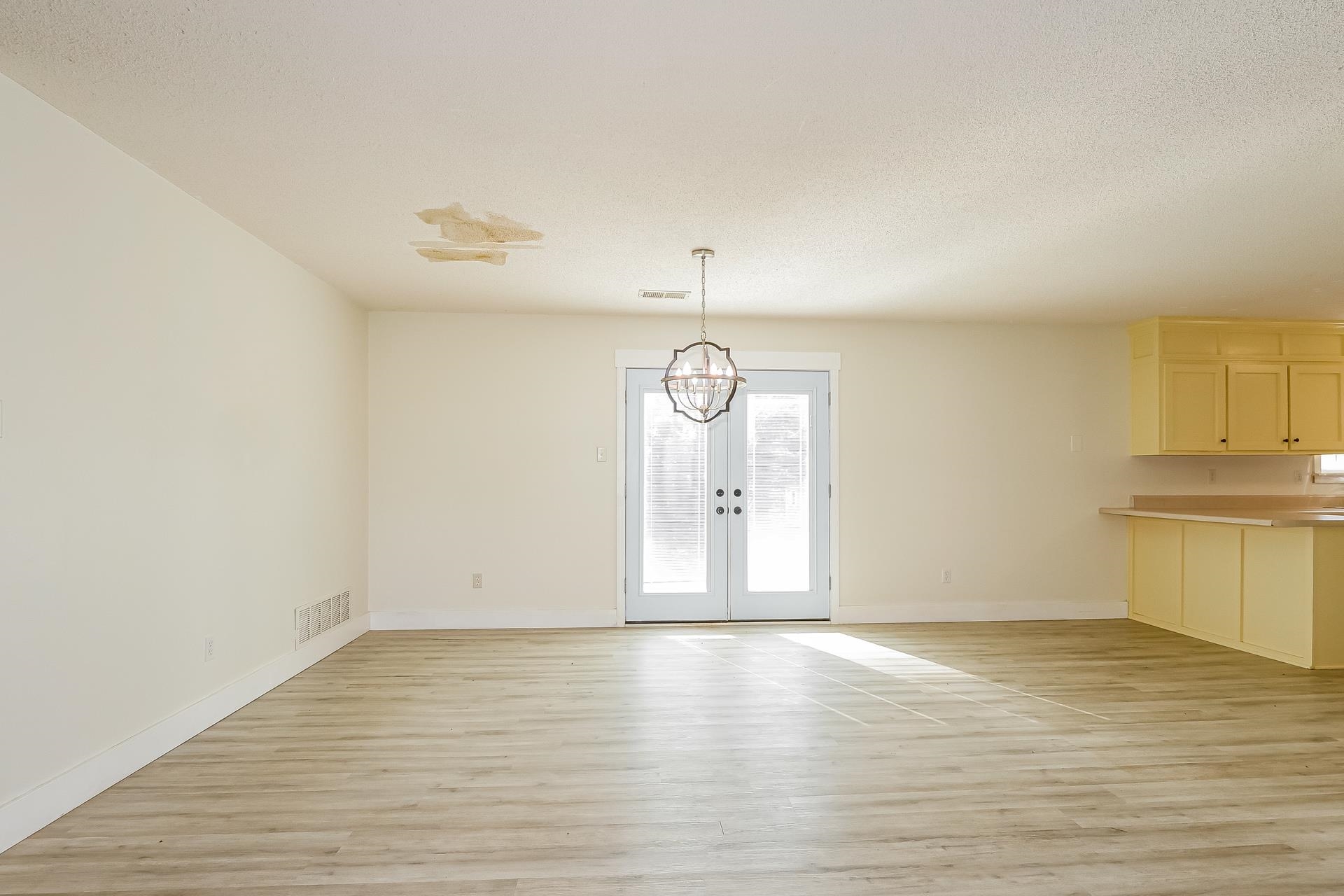 188 David Reed Drive Munford, TN 38058 - Photo 5 of 20 Spacious open-concept room featuring wood-finish flooring, white baseboards, and neutral wall tones
