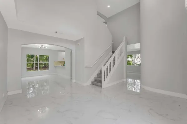 a view of an empty room with stairs