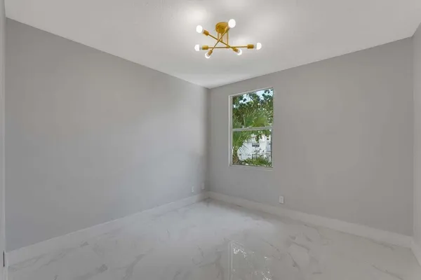 an empty room that has a window